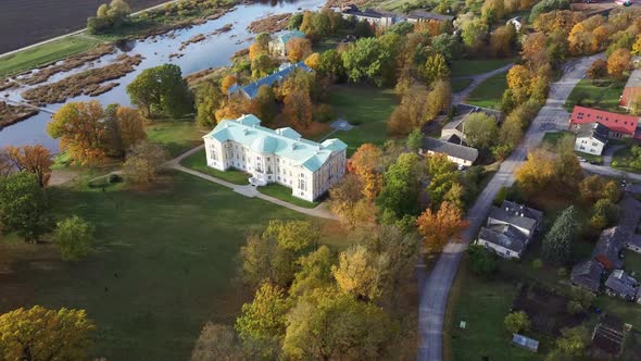 Autumn Aerial Landscape of the City Mezotne and Palace With Park Near Lielupe River, Latvia 4K Video