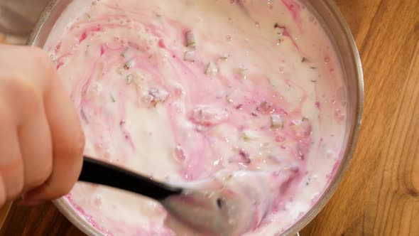 Mixing cold beetroot soup to get beautiful and delicious pink color