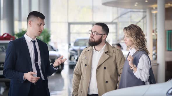 Sales Manager in a Car Dealership Serves a Married Couple