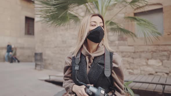 Tourist Woman in Mask on Street with Dslr Photo Camera