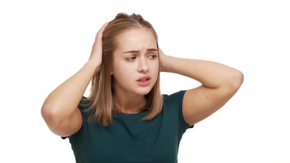 Close Up Portrait of Nervous Female with Straight Golden Hair Worrying About Something with Neurotic