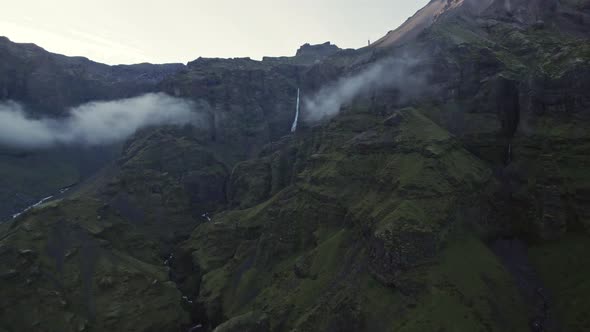 Drone Flight Over Mountains Towards Waterfall