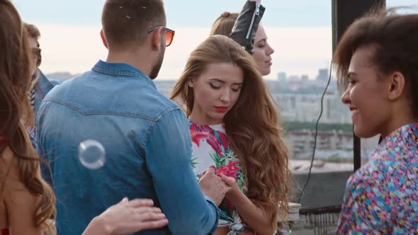 Adorable Young Couple at Day Rooftop Party