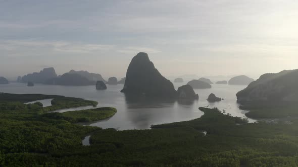 Drone Shot During Sunrise of the Mountains and Lake at Thailand