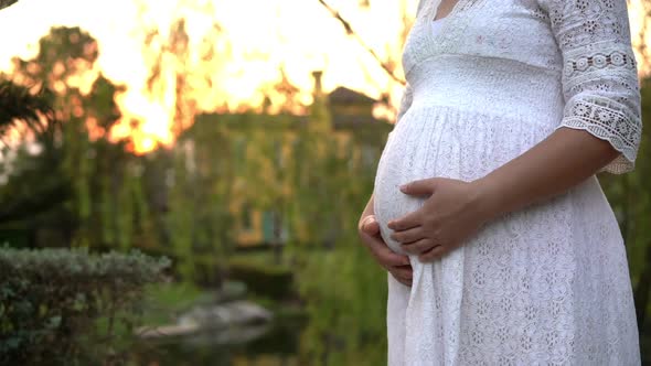 Pregnant Woman Feeling Happy at Garden Home