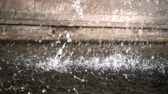 Waterfall And Brick Wall