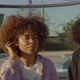Two Mixed Race Black Woman with Huge Afro Hair Outdoors Watching To the Camera - VideoHive Item for Sale