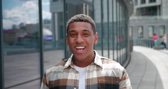 Excited Young African American Man Lookng at Camera and Rejoices Good News