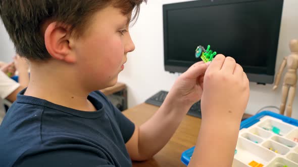 Boy Making Robot Using Building Kit