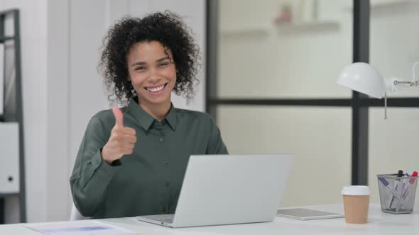 Thumbs Up By African Woman with Laptop