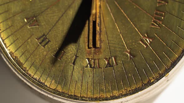 Sundial Shows Time From Bright Rays. White Background. Close Up