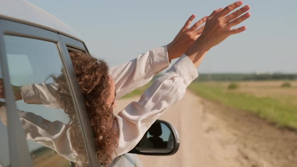 Female Passenger Enjoying Air Flow