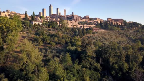 San Gimignano town in Tuscany Italy in full view, Aerial drone approach reveal shot