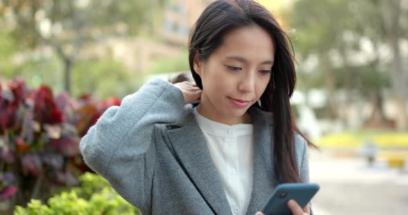 Young Businesswoman use of smart phone in city