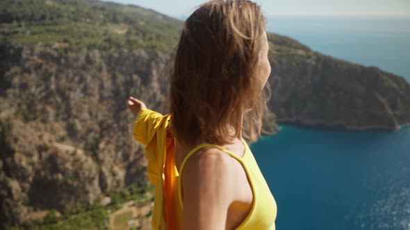 Slow Motion Happy Traveler Freedom Filling Woman with Open Arms Smiling and Enjoying Sea Coast View