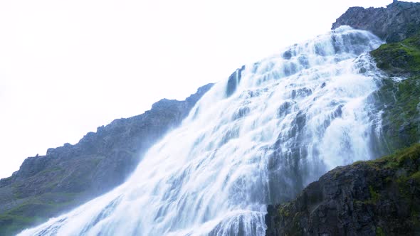 Dynjandi Waterfall - Water Cascading Down On Cliff At Fjallfoss In Westfjords, Iceland.