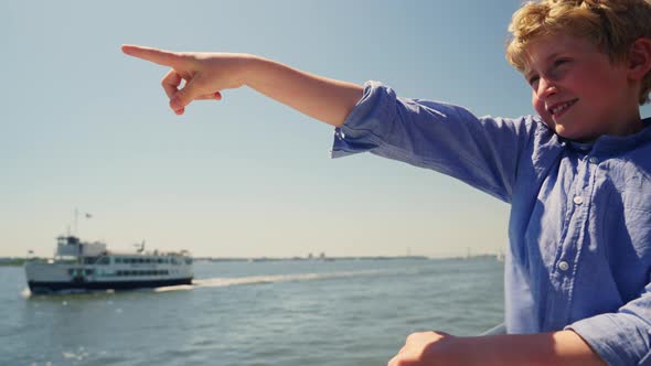 Portrait of a Happy Smiling Boy Travelling on Board of a Small Sightseeing Ship