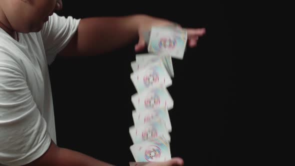 Magician Starts Showing His Trick With Cards, Cards Cascading Down
