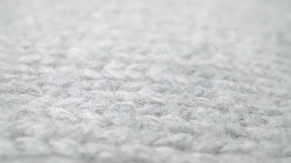 Extreme Detail View of Sheep Wool Cloth Texture Flowing in Macro Dolly Shot