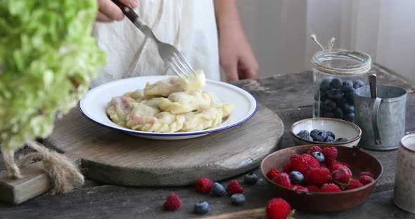 Woman made a homemade dumplings or Pierogi