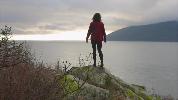 Adventurous Girl Looking at the Beautiful Scenery on the West Pacific Ocean Coast