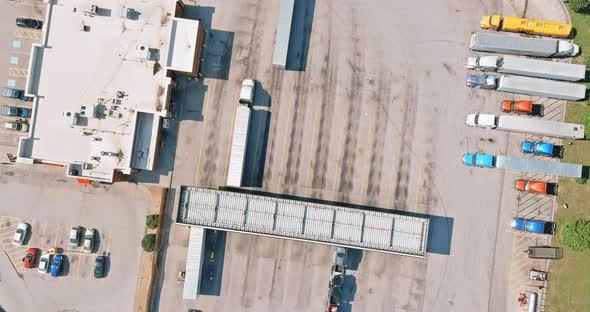 Top View Car Parking for Heavy Trucks Stop on Rest Area in the Highway Trucks Stand in a Row