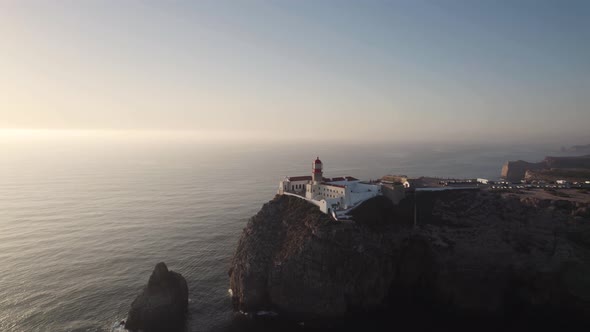 Sunset at Lighthouse of Cabo de Sao Vicente, Algarve, Portugal. Orbiting shot