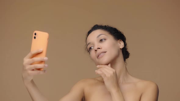 Beauty Portrait of Young African American Woman Taking Selfie Using Smartphone