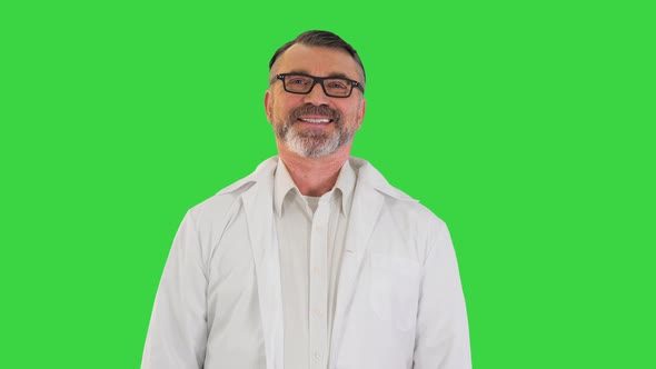 Senior Doctor Standing and Smiling To Camera on a Green Screen Chroma Key