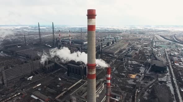 Aerial View of High Pipes with White Smoke From Plant. Bird's-eye of Factory Production. Industrial