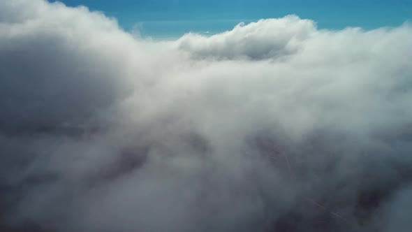 Fog morning at downtown district. Above the clouds.