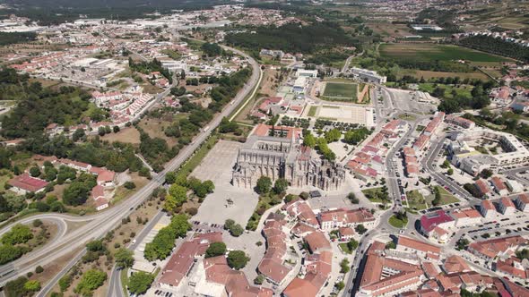 Aerial panoramic view over Batalha monastery and surrounding landscape, Portugal