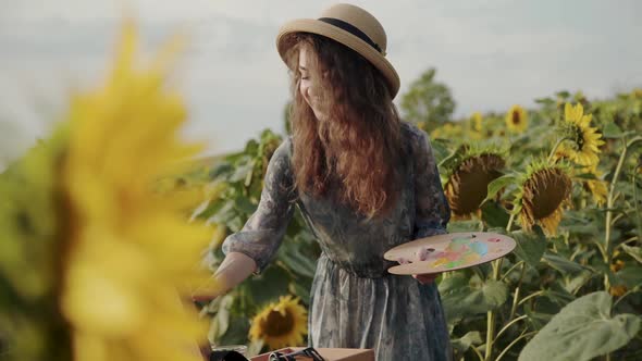 Happy Lady Painting Among Beautiful Sunflowers with Flying Bee
