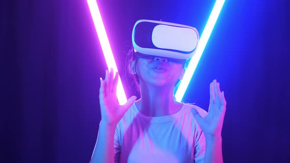 Vr, Futuristic, Excited Asian Young Girl Using Virtual Reality Headset With Neon Light