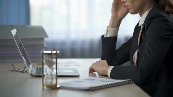 Businesswoman Looking at Laptop, Lying on Table, Exhaustion, Deadline Pressure