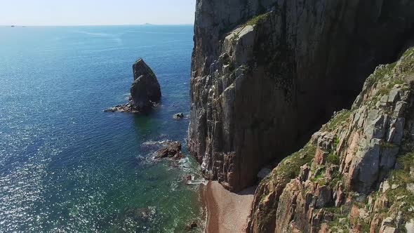 View From a Drone of the Coastline with a Rocky Coast and Hight Cliffs
