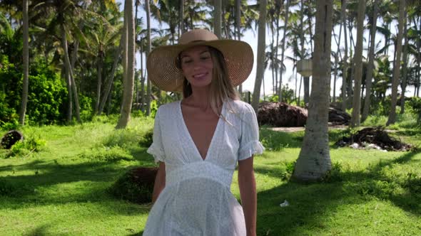 Girl on Vacation Taking Pleasure From Walking in Palm Forest Alone