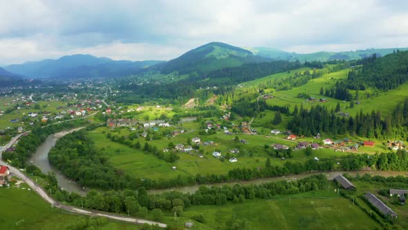 Aerial View of a Green Rural Area Under Blue Sky