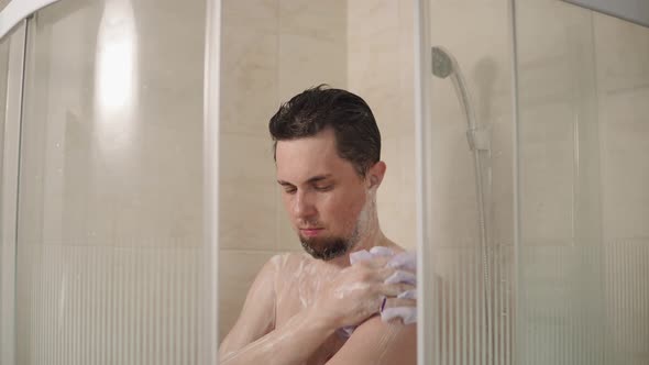 Portrait of a Man Who Decided To Wash the Dirt Off the Body with a Washcloth