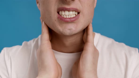 Unrecognizable Man Massaging His Neck Suffering From Muscles Pain Close Up