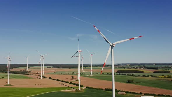 A Drone Shot of a Massive Wind Farm in Agricultural Land