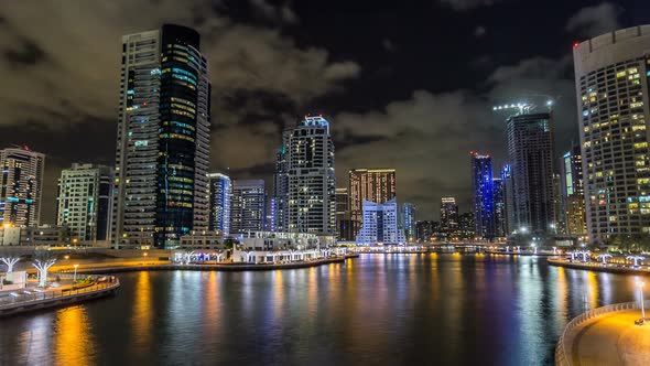 View of Dubai Marina Towers and Canal in Dubai Night Timelapse Hyperlapse