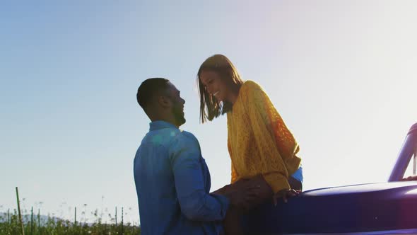 Young couple on a road trip in their pick-up truck