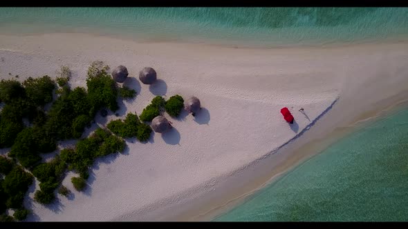 Aerial view scenery of marine coastline beach lifestyle by aqua blue sea and white sandy background 