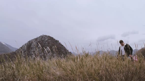 back view of active Family  with kids enjoying valley and mountain view in Montenegro