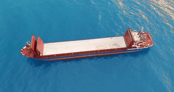Freight Ship Floating on Sea. Aerial View.