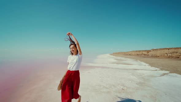 Slow Motion Footage Beautiful Landscape and Woman Walking at White Beach Near Salt Pink Lake