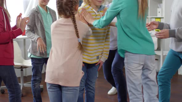 Teenage Boy Playing Trust Building Game with Friends alt