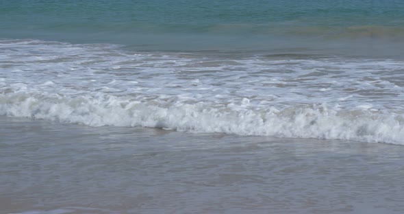 Water wave on sand beach