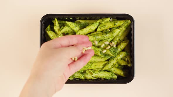 Pasta with Pesto Sauce and Pine Nuts Closeup